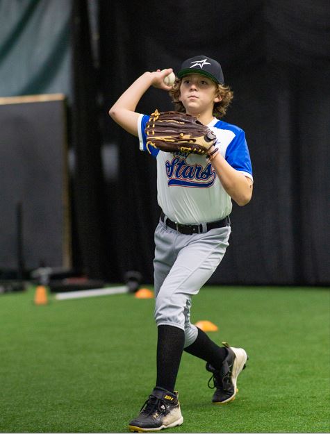 Young person throwing baseball