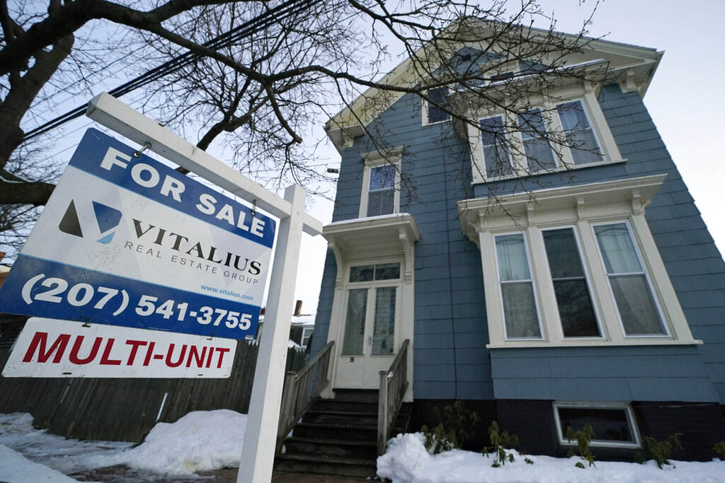 A sign announces a home for sale on Munjoy Hill in Portland, Maine.