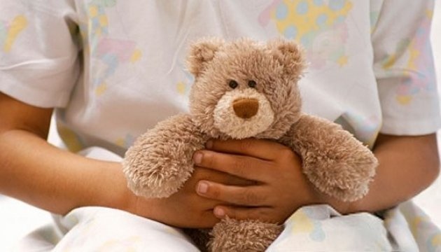 child with teddy bear