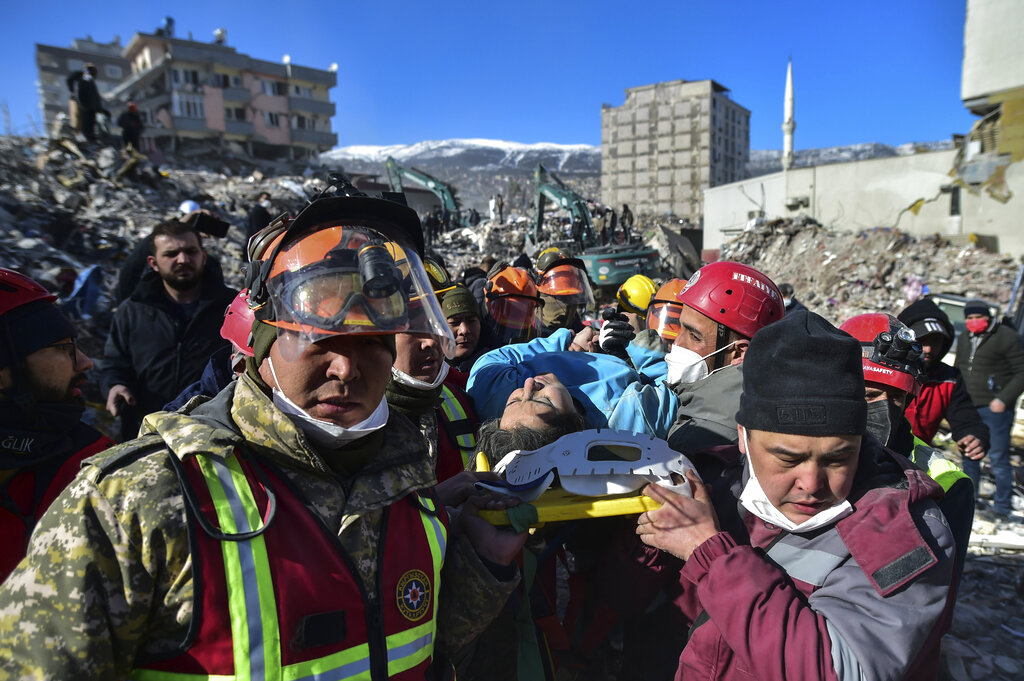 Rescue workers from Kazakhstan and Turkey pull out Hatice Akar from a collapsed building 180 hours after the earthquake in Kahramanmaras, southern Turkey