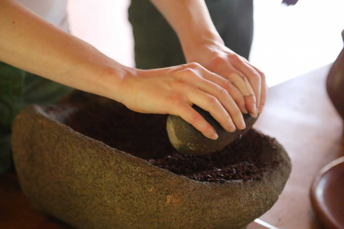 Grinding chocolate into fine mixture