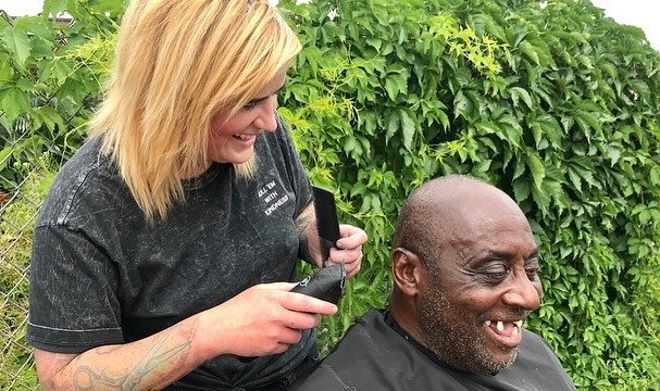 Man getting haircut on street