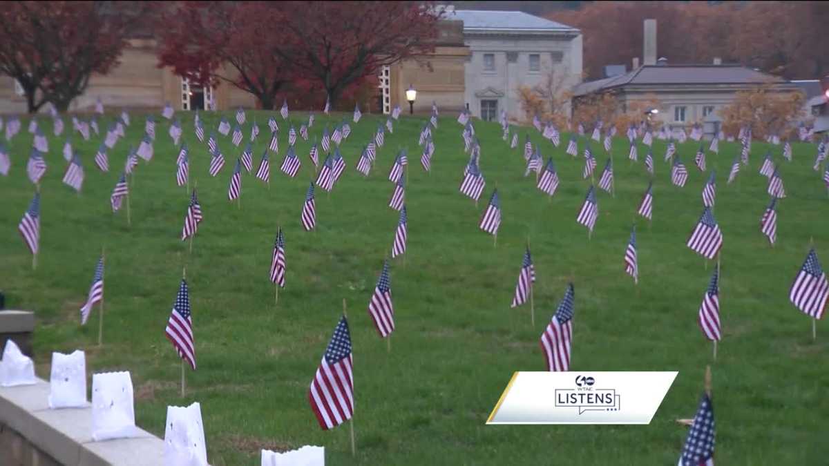 Flags are planted in a field for Memorial Day