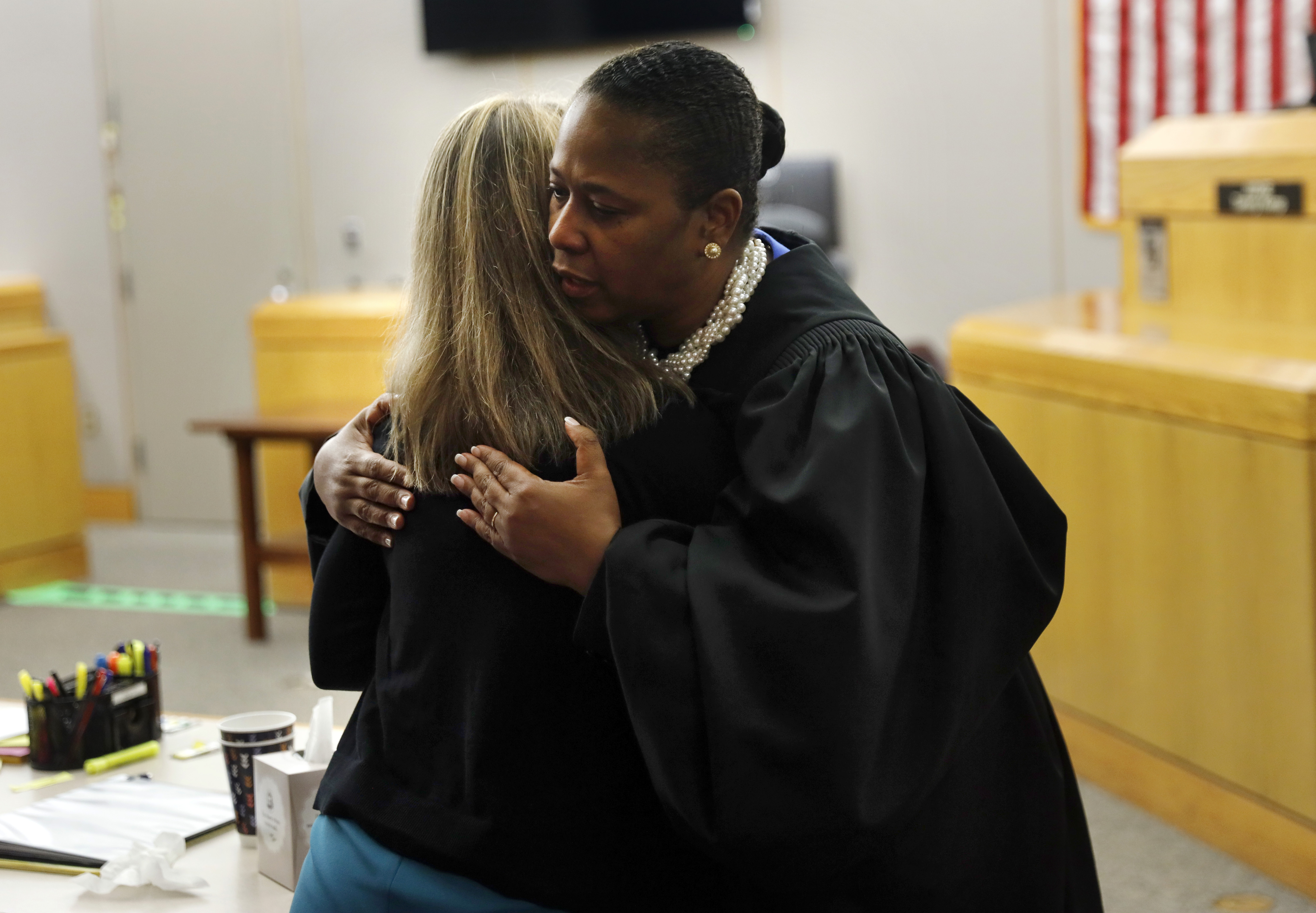  Judge Tammy Kemp gives former Dallas Police Officer Amber Guyger a hug