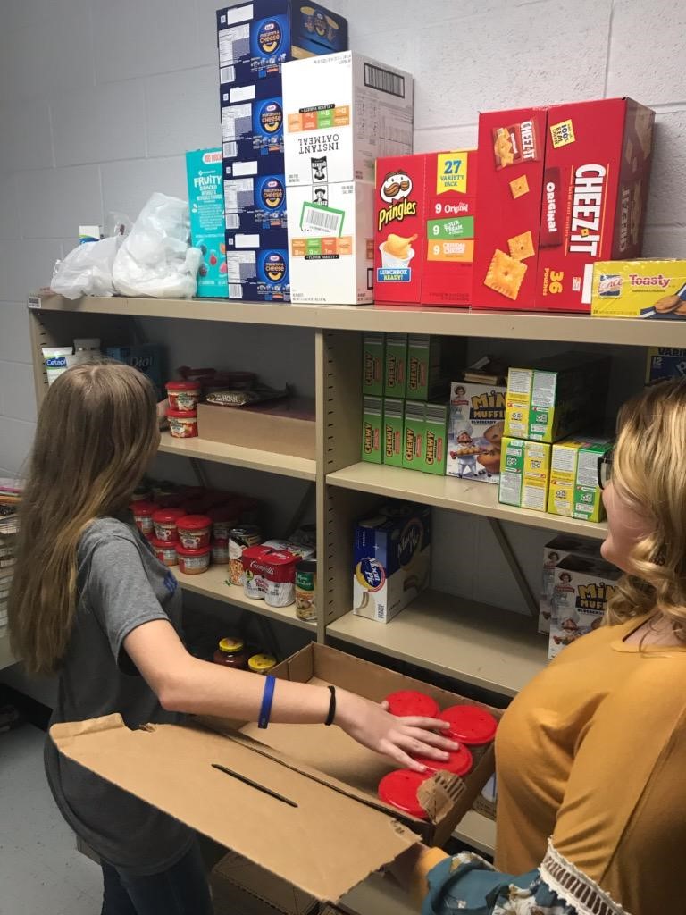 Students stocking school pantry