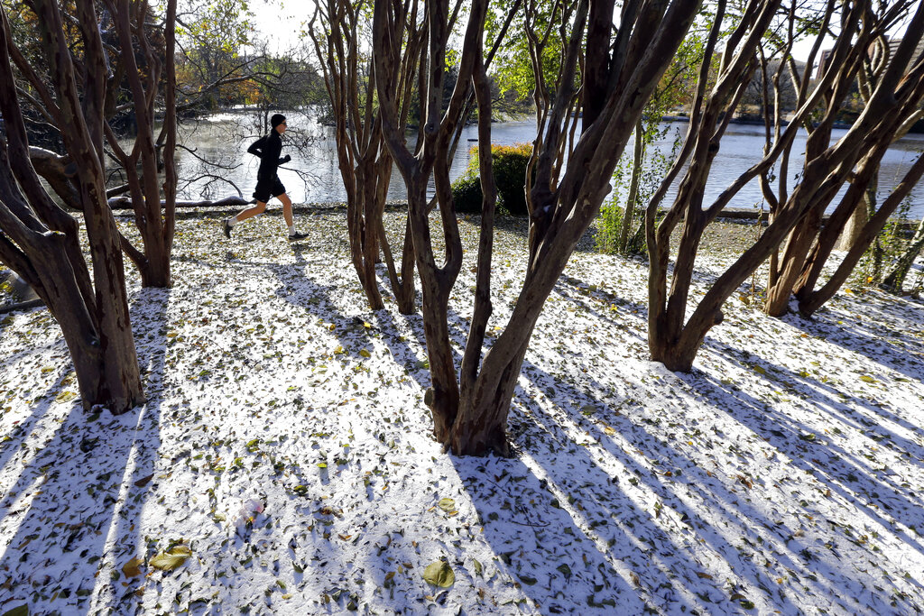 A jogger braves temperatures in the teens as he goes for a run Tuesday, Nov. 12, 2019, in Nashville,