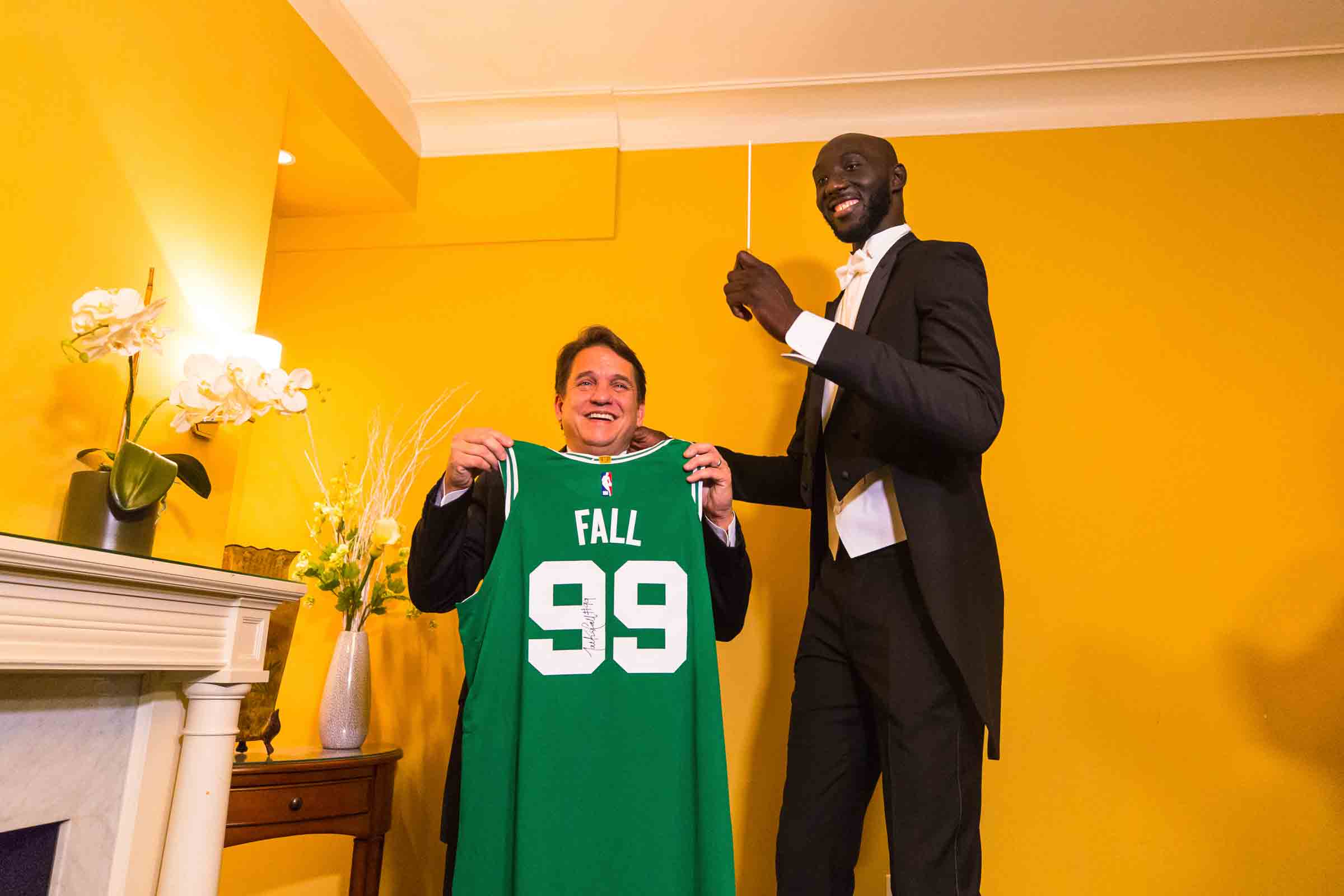 photo provided by Boston Pops, Boston Celtics player Tacko Fall, right, poses for a photo with Boston Pops Orchestra conductor Keith Lockhart in Boston