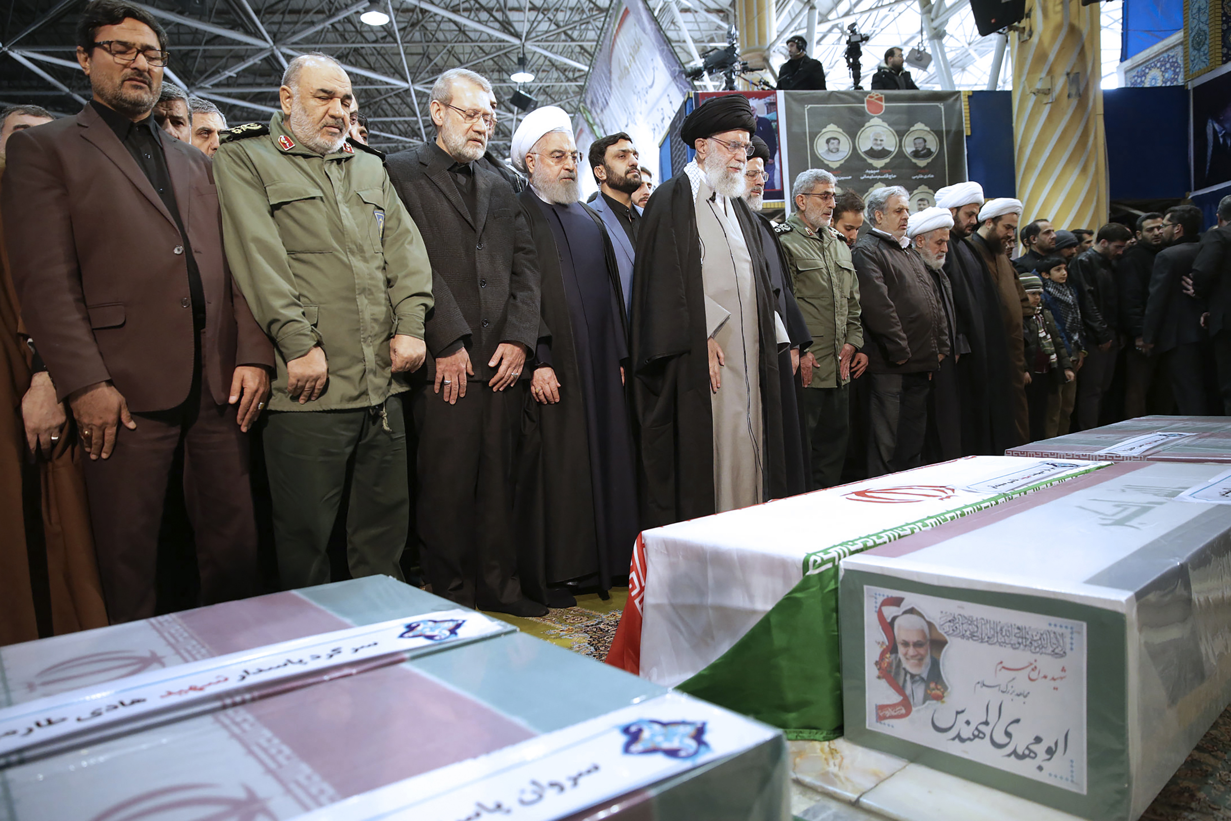 Ayatollah Ali Khameneileads a prayer over the coffins 