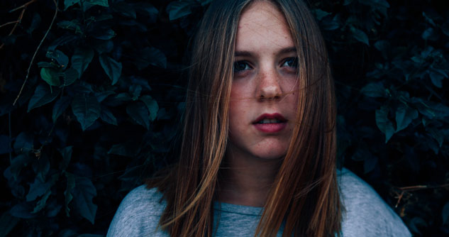 Teen girl with faraway look