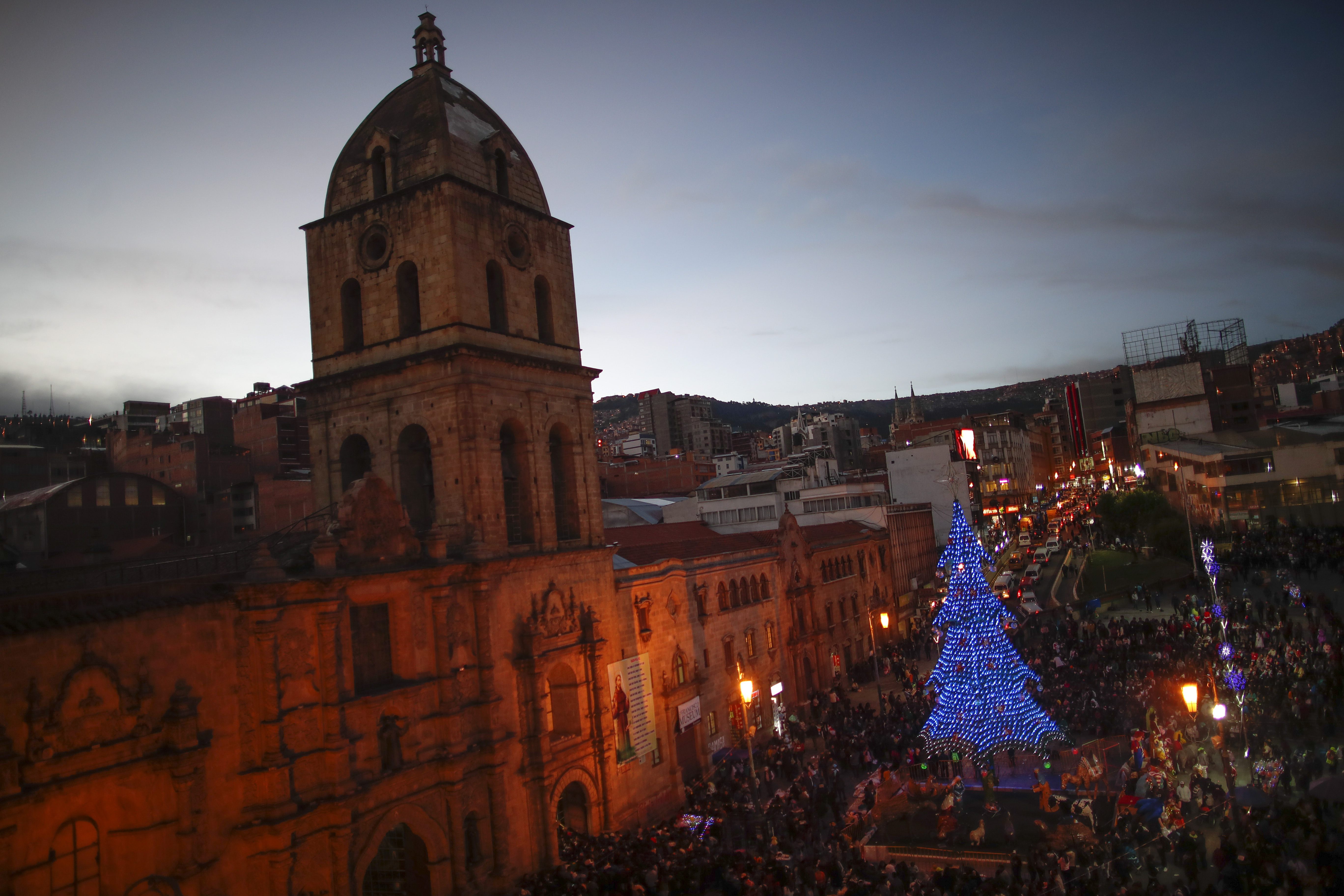 Worshippers stand outside San Francisco Church during Three Kings Day celebrations in La Paz, Bolivia. After Mass was celebrated inside the church, many parishioners flocked to indigenous guides to get additional blessings that come from the country