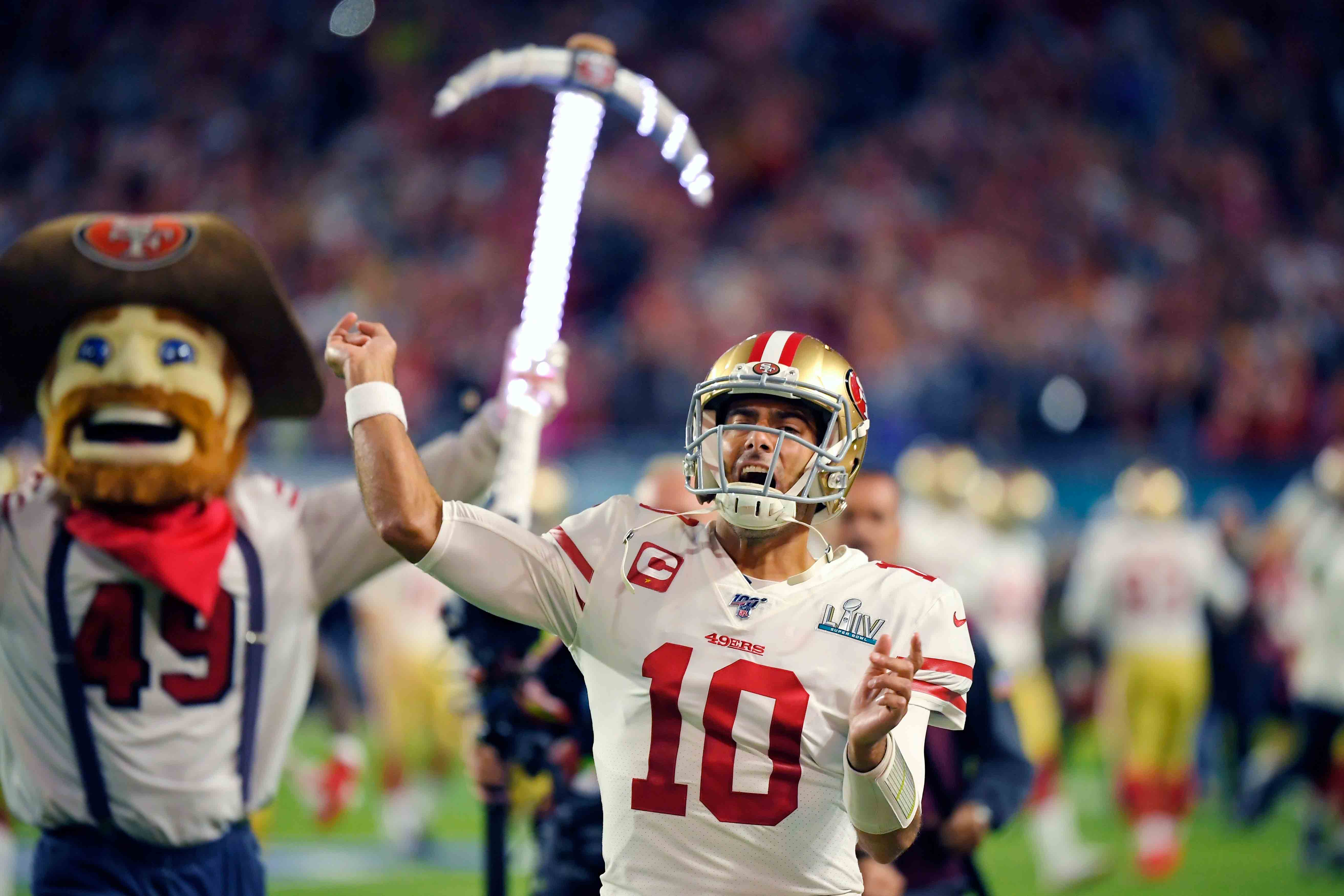 San Francisco 49ers quarterback Jimmy Garoppolo runs onto the field before the NFL Super Bowl 54 football game against the Kansas City Chiefs